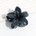 Dark grey plumeria flower hair claw clip detail close-up showcasing jelly texture. - Gray