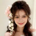 Beautiful floral hair accessory set featuring delicate pink and white flowers worn by model. - Lily of the Valley Pink
