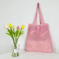 Pink knit tote bag with hollow-out design, stylish casual shoulder bag for women daily use. - Pink