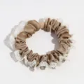Detail shot of the brown satin scrunchie featuring elegant white lace ruffle trim texture. - Brown