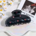 Detalle pinza de pelo pedrería corazón, garra pelo mármol negro, accesorio elegante cabello. - Cristal de Corazón Negro