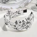 Black and white floral twist headband, elegant wide fabric hair hoop for daily fashion. - Knotted Floral Style / White