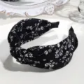 Chic black and white floral knotted headband for women, wide brim fashion hair accessory. - Knotted Floral Style / Black