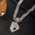 Detail shot of a hip-hop rhinestone Cuban chain necklace featuring a poker card pendant. - Pendant With Cuban Chain / Silver