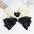 Sweet French style bow hair claw clip featuring cream satin and black polka dot mesh design. - Black and White