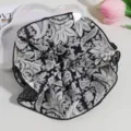 Elegant black and white floral scrunchie hair band for stylish ponytails and buns. - Black Polka Dot Print