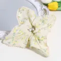 Close-up detail of the sweet yellow floral scrunchie featuring delicate lace trim and soft fabric. - Yellow Square Floral