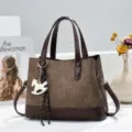 Brown textured tote bag with leather contrast, elegant shoulder handbag and chic charm. - Coffee