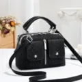 Black vintage leopard print boston shoulder handbag with double front pockets and silver hardware. - Black