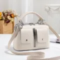 Retro beige boston handbag with top handle and front pockets for women commute daily use - Off White