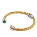 bracelet jonc cable torsade en acier inoxydable dore 18k avec une pierre bleue - Décembre