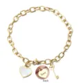 Bracelet en acier titane doré avec breloques cœur coquillage et clé pour variante. - Or