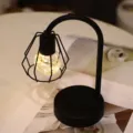 Modern minimalist black desk lamp with geometric metal cage shade for cozy bedside decor. - Small Table Lamp / Warm White