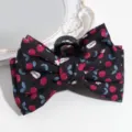 Close-up detail of the sweet cherry print fabric bow hair claw clip, elegant and charming. - Black Bear Cherry