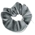 Close-up of grey velvet scrunchie featuring a hidden zipper pocket for small storage. - Gray Zipper Scrunchie