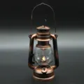 Vintage solar LED camping lantern, retro portable bronze metal emergency light for outdoor hiking. - Flickering Flame Lantern