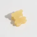 Yellow bear hair claw clip close-up, cute mini hair accessory for side bangs styling. - Yellow