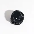 Detail shot of a cute black mini bear hair claw clip, perfect for styling bangs and hair. - Black Puppy
