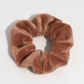 Close-up detail shot showing the soft brown velvet texture of the chic hair scrunchie. - Brown