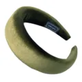 Detailed closeup of dark green velvet padded headband, soft plush texture and handmade tag. - Green Velvet