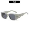 Retro grey cat-eye sunglasses for women with stylish silver heart decor variant C2. - Jelly Milk Gray Frame Gray Lens (18153)