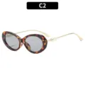 Stijlvolle retro ovale zonnebril in C2 schildpadkleur met mooie parels voor dames. - C2-Schildpad Montuur Grijze Glazen