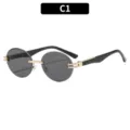 Elegantes gafas de sol redondas sin montura con detalles de metal dorado y lentes oscuras. - Montura dorada con lentes grises