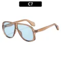Occhiali da sole oversize vintage con montatura marrone traslucida e lenti azzurre. - Montatura Tè Lenti Blu (C7)