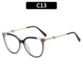 Chic oversized cat-eye sunglasses with retro metal heart temples, perfect for outdoor fashion styles. - Black Frame Khaki Sides