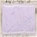 Detailed view of a lavender cotton beach towel featuring white stripes and nice decorative tassels. - Purple