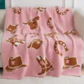 Cozy pink fuzzy throw blanket with cute cowboy hat and horseshoe knit pattern for living room. - Boots and Hats