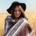 Detailed shot of a Mexican tribal geometric striped blanket with fringes, lifestyle outdoor view. - Burgundy / 35*200cm
