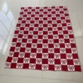 Red and white checkered knit blanket with cute bow patterns, cozy winter home decor. - Gingham Bow