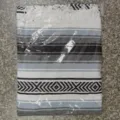 Woven Mexican blanket detail with geometric stripes and fringe, perfect as a beach mat or yoga rug. - MC Blue Grey