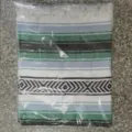 Mexican style woven blanket with geometric stripes and fringe, packaged variant design. - Emerald White
