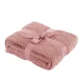 Detailed close-up of a cozy pink knitted throw blanket tied with elegant satin ribbon bow. - 130x170cm (500g) / Dusky Pink