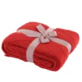 Detailed close-up view of the red knitted blanket designed with an elegant ribbon bow decor. - 130x170cm (500g) / Red