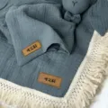 Double layer infant gauze blanket with white tassels and custom label, dark grey newborn swaddle. - Lake Blue