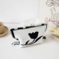 Vista detallada del soporte de pañuelos de punto con motivo de tulipán para decoración. - Flor