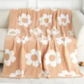 Cozy daisy pattern microfiber blanket detail view, soft knitted throw for living room sofa. - Khaki & White Flowers