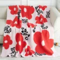 Cozy pink knit blanket featuring bold red floral and chic leopard print patterns for home. - Red & Pink 3-Color Flowers