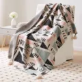 Bohemian knitted blanket with geometric patterns and tassels for sofa and cozy living room decor. - Pendants - Ramir
