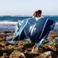 Woven beach blanket with Aztec Navajo thunderbird pattern, perfect for outdoor travel decor. - Navy Blue