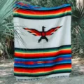 Mexican woven thunderbird blanket with colorful striped design for boho decor and beach use. - White