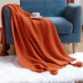 Orange knitted throw blanket with tassels and pineapple texture for cozy sofa and home decor. - 120*150CM / Caramel color