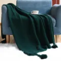 Dark green knitted throw blanket with tassels, cozy sofa blanket for home and living room. - Dark Green