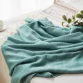 Green herringbone woven throw blanket with fringe, stylish acrylic couch cover for home decor. - Big Wave Pattern - Dark Green