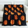 Black plush throw blanket with vibrant basketball pattern, soft cozy knit home decor. - 127x152cm - 900g / Basketball - Black & Orange