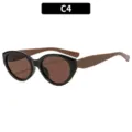 Fashion cat-eye sunglasses for women with stylish black frame and brown lenses. Chic sun eyewear. - Black Frame Brown Legs Tea Lens