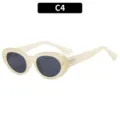 Gafas de sol ovaladas vintage para mujer con montura crema, lentes oscuras y detalles metálicos chic. - Amarillo Gelatina